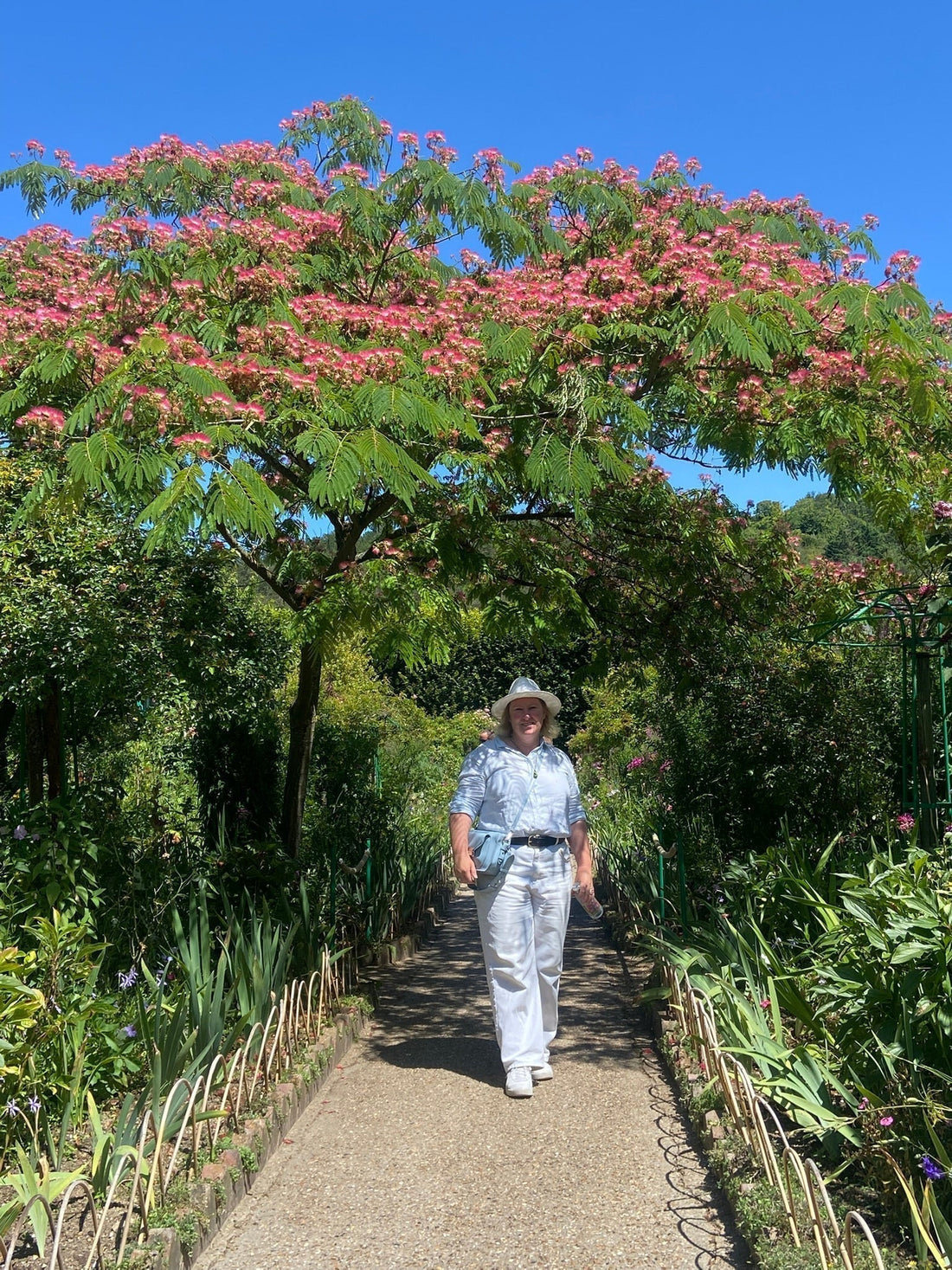 Melleny Black standing under a tree