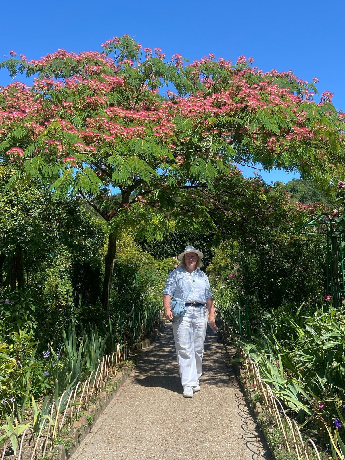 Melleny Black standing under a tree